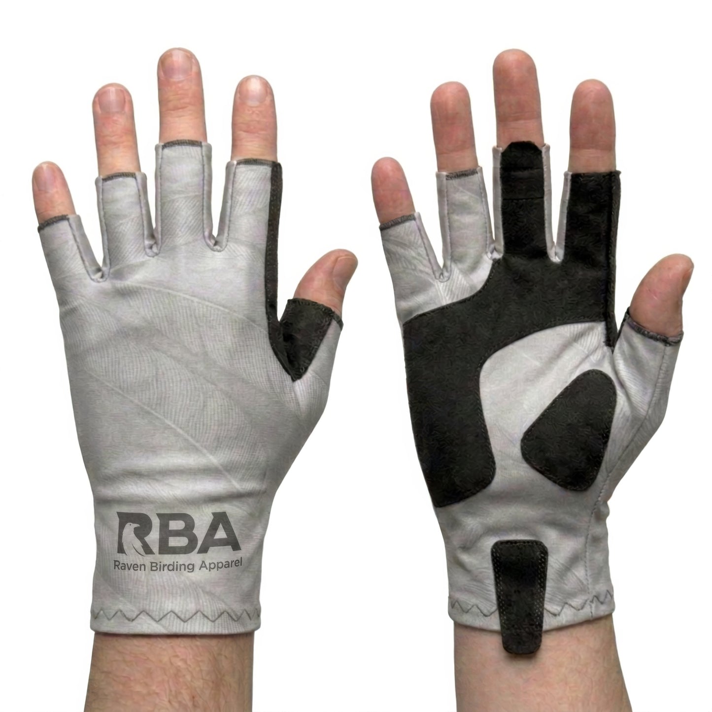A pair of fingerless cycling gloves shown on hands against a white background, displaying both the light gray palm side with black thumb and backhand grip patches, and the black back side with a light gray palm.