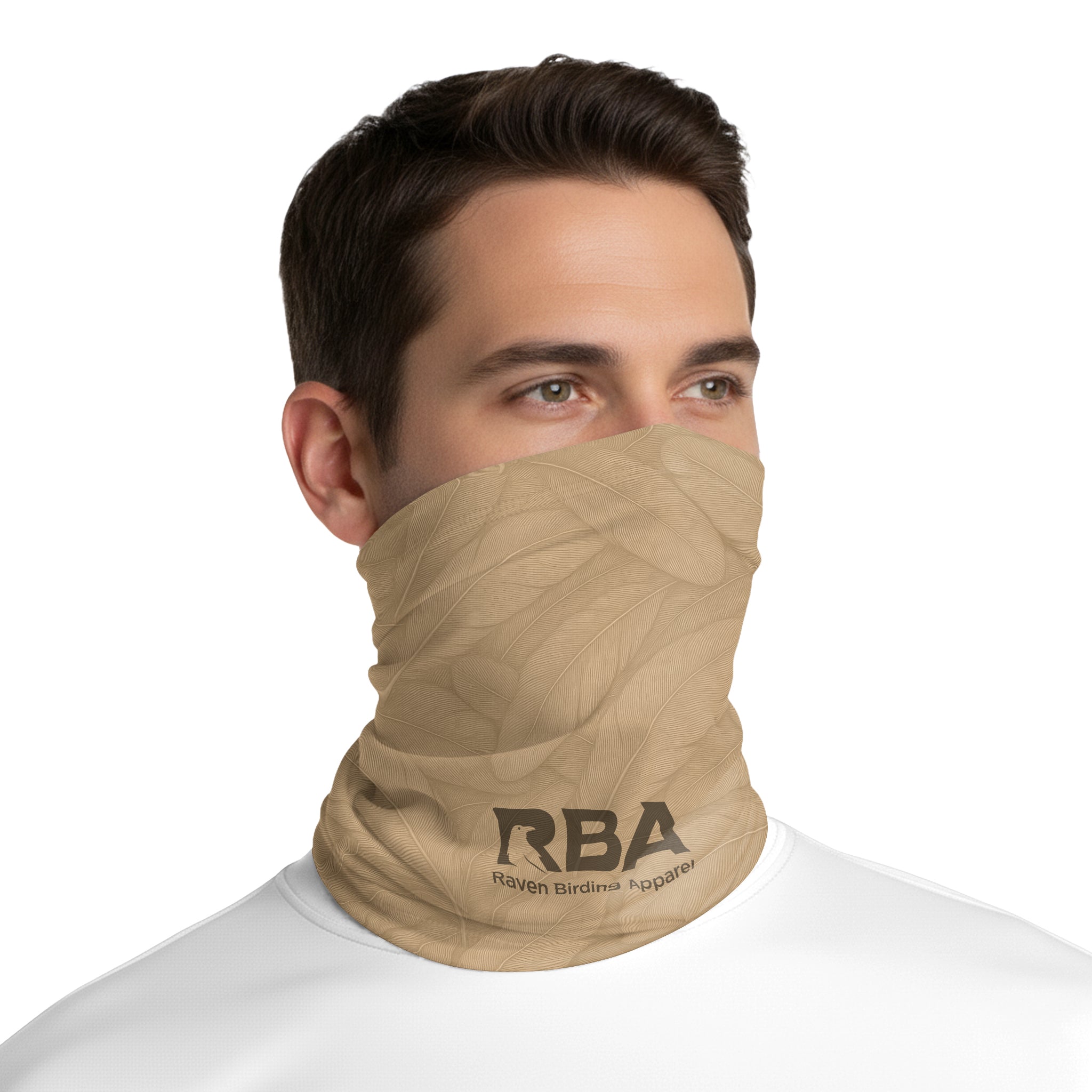 Man wearing an Earthen Tan neck gaiter with a Raven Birding Apparel logo.