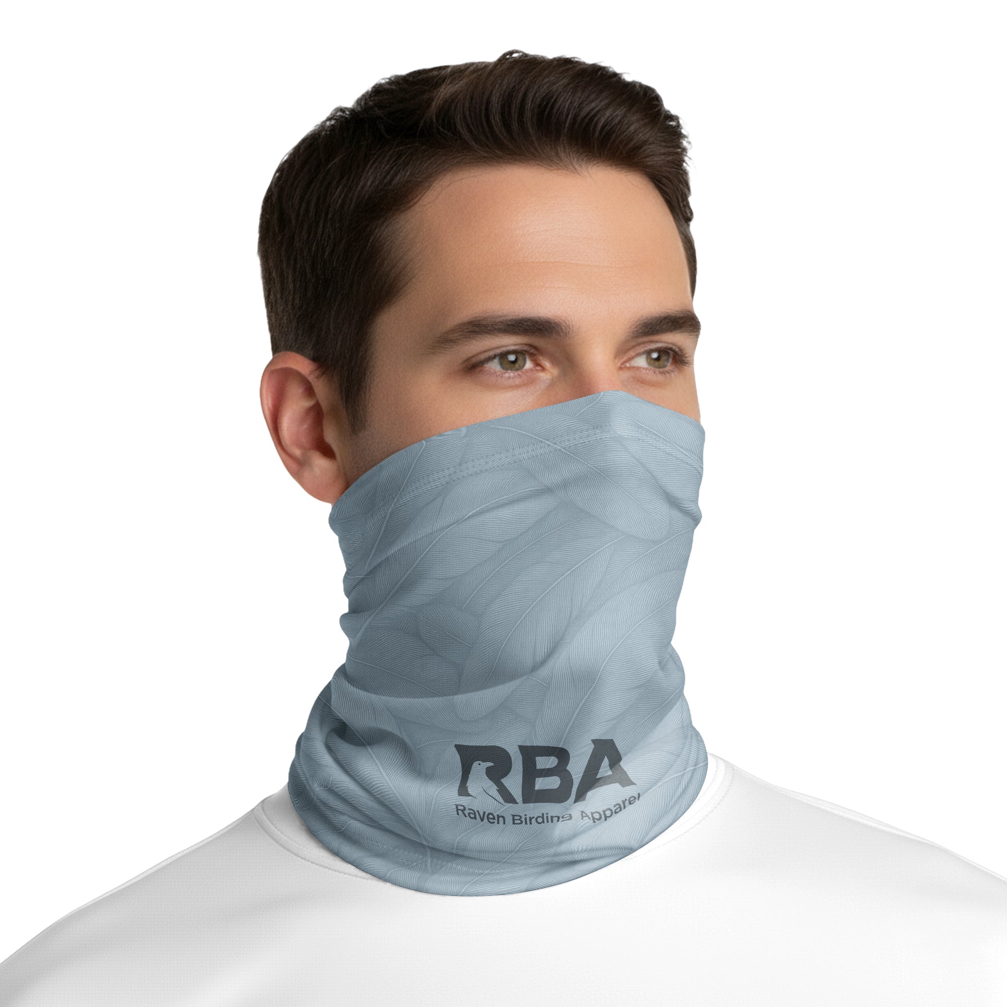 Man wearing a Harbor Blue neck gaiter with a Raven Birding Apparel logo.