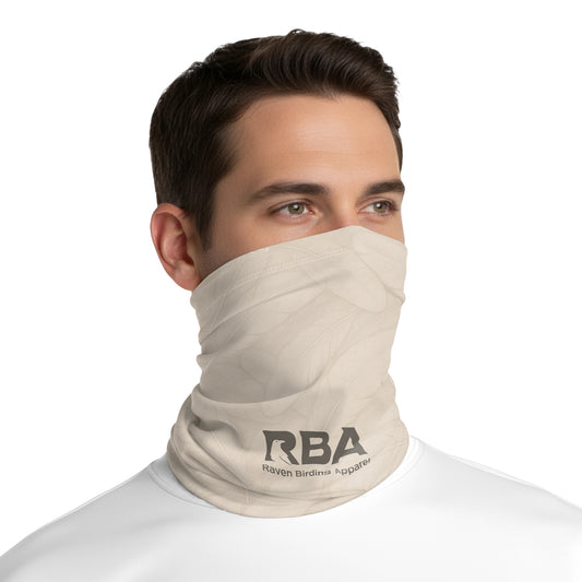 Man wearing a Pale Dune neck gaiter with a Raven Birding Apparel logo.