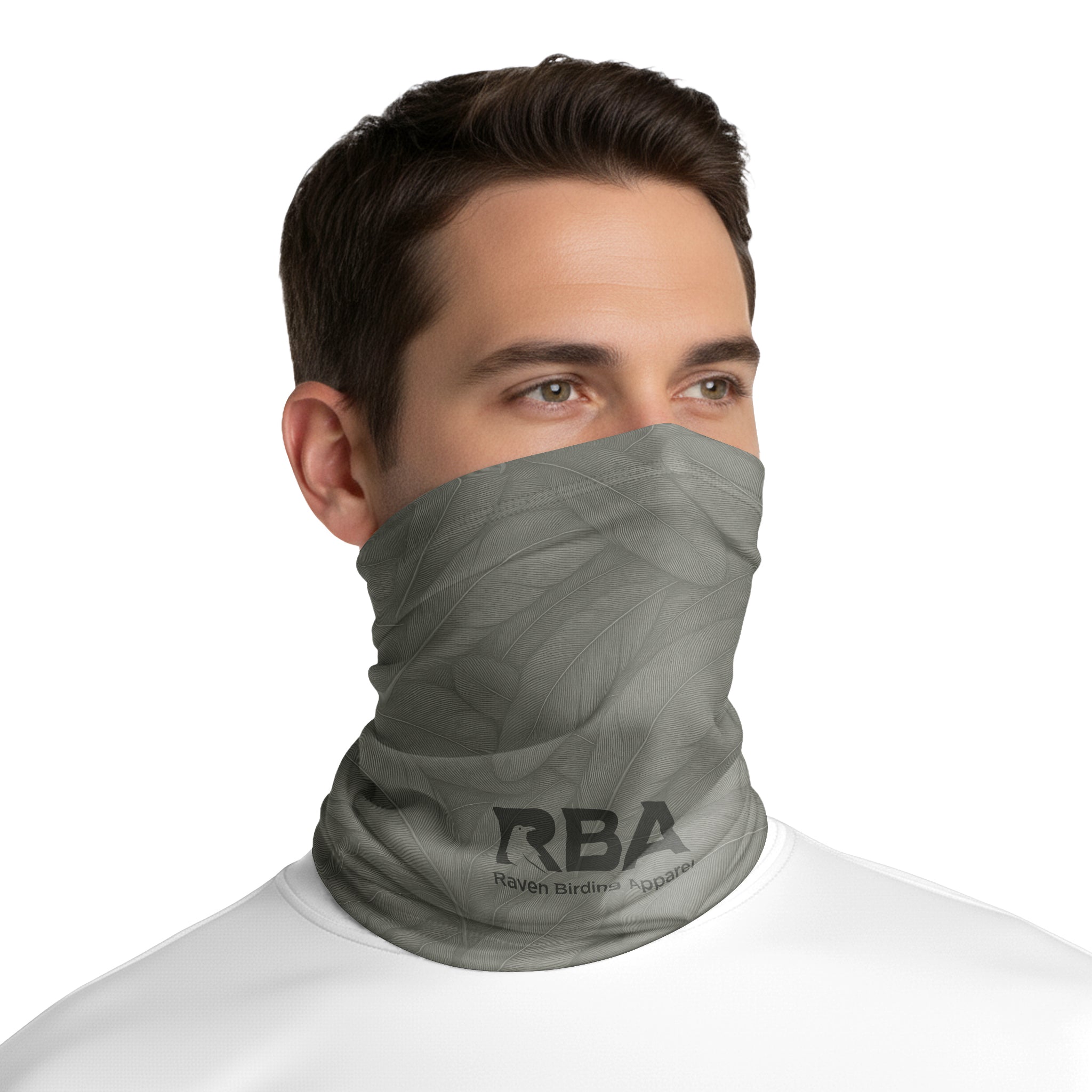 Man wearing a Stone Olive neck gaiter with a Raven Birding Apparel logo.
