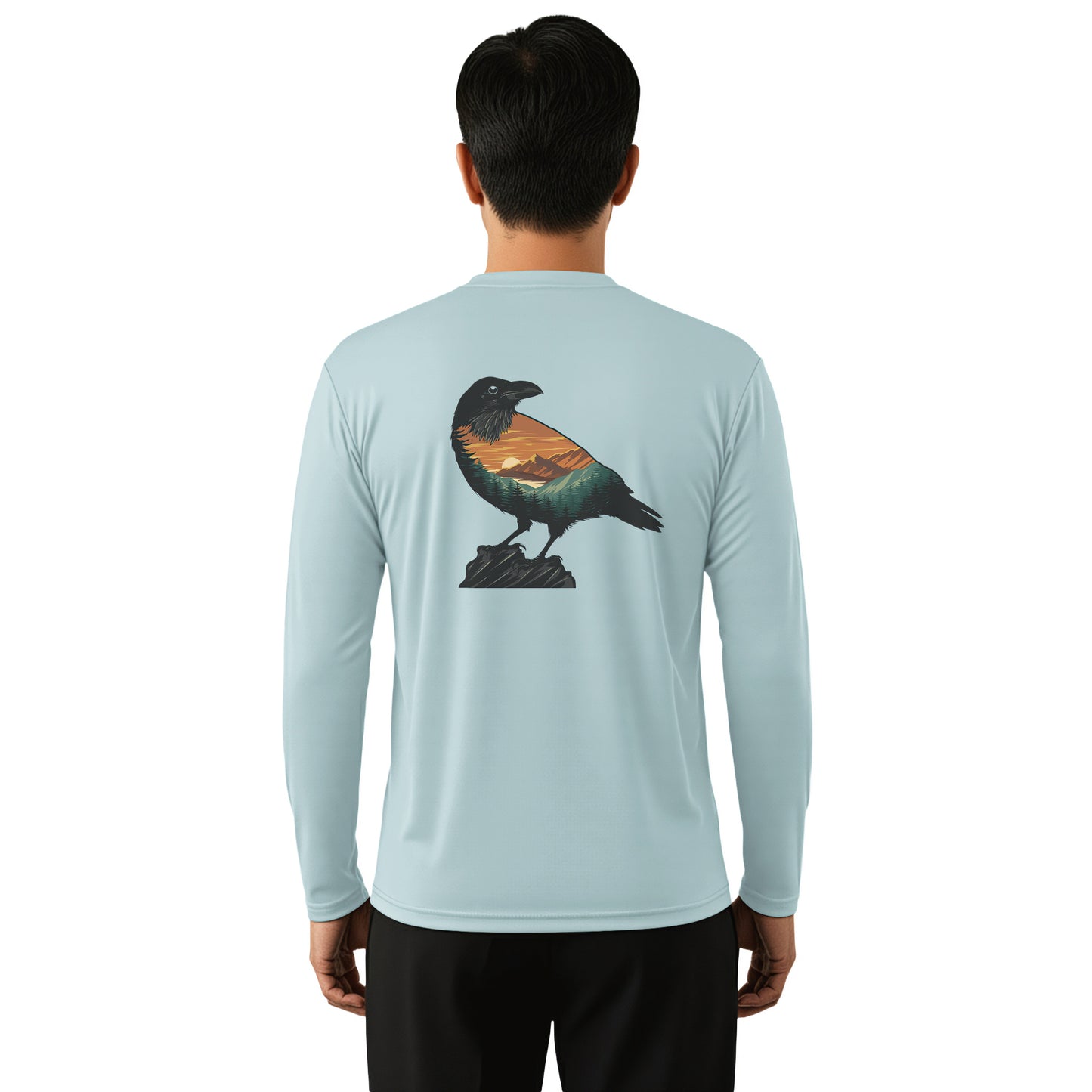A man viewed from the back wearing a light blue long-sleeve performance shirt with a detailed graphic of a raven on the back, set against a plain white background.