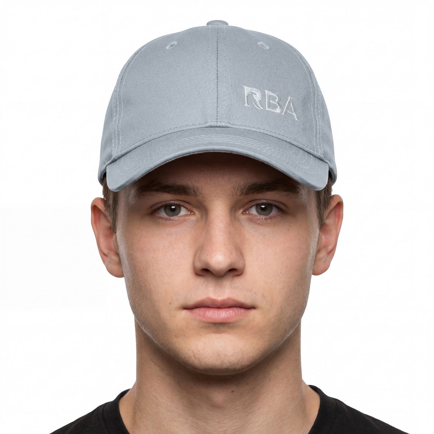 Man wearing a gray cap with 'RBA' logo on a white background